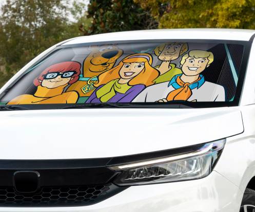 Animated characters resembling the Scooby-Doo gang are printed on a car sunshade, visible through the windshield of a white vehicle.